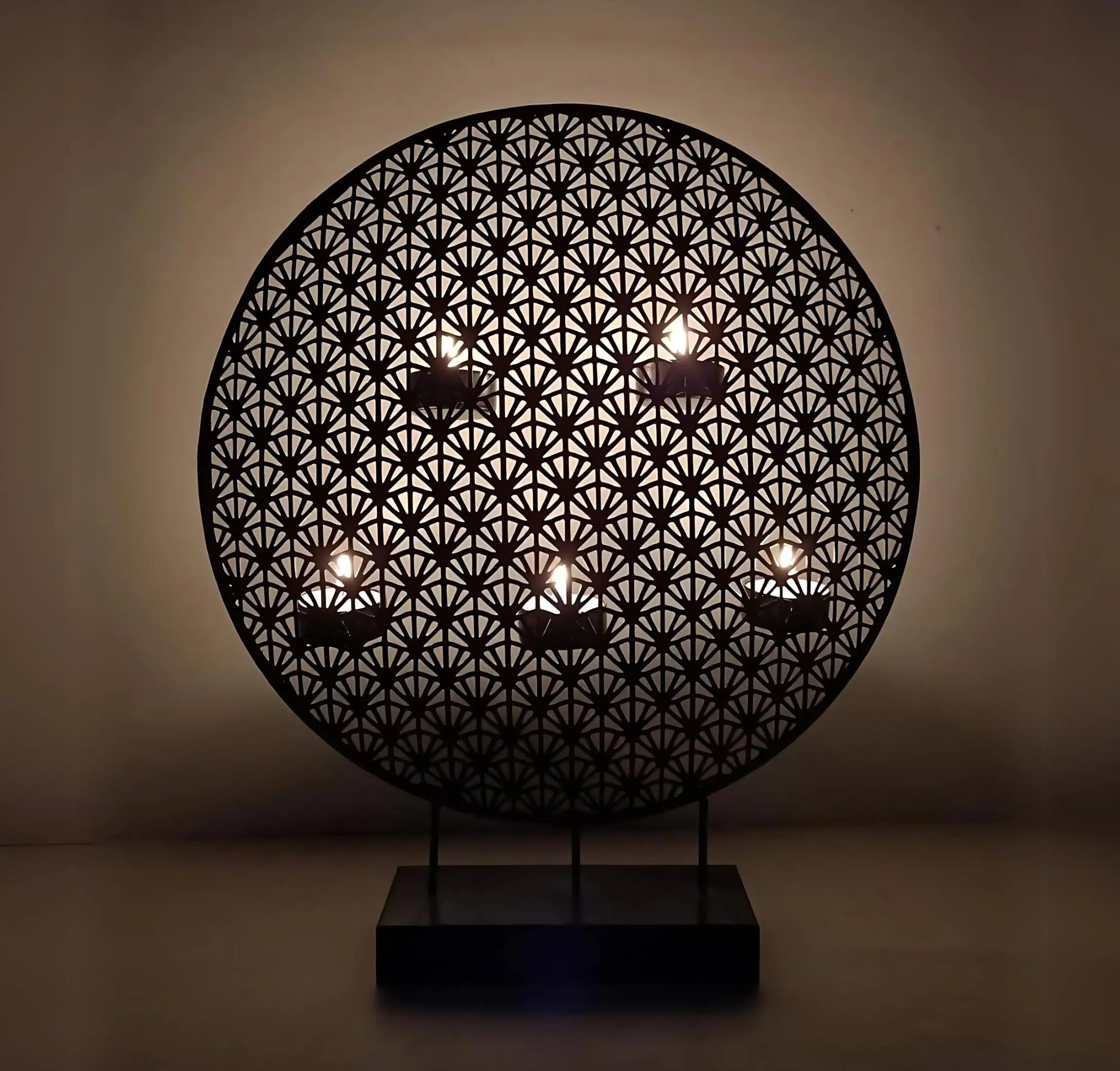 black round metal tealight candle holder mall on moon